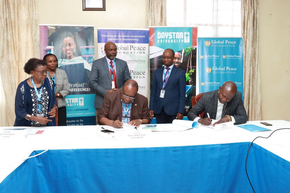 Dr. Laban Ayiro, Vice Chancellor, Daystar University and Mr. Daniel Juma Omondi, Executive Director, Global Peace Foundation Kenya During the MOU Signing at Daystar University